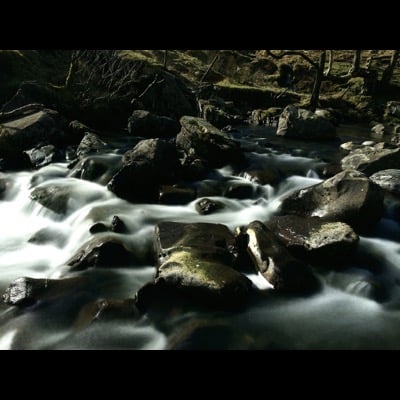 Rocks and water by NightCap team. Settings: Long Exposure mode